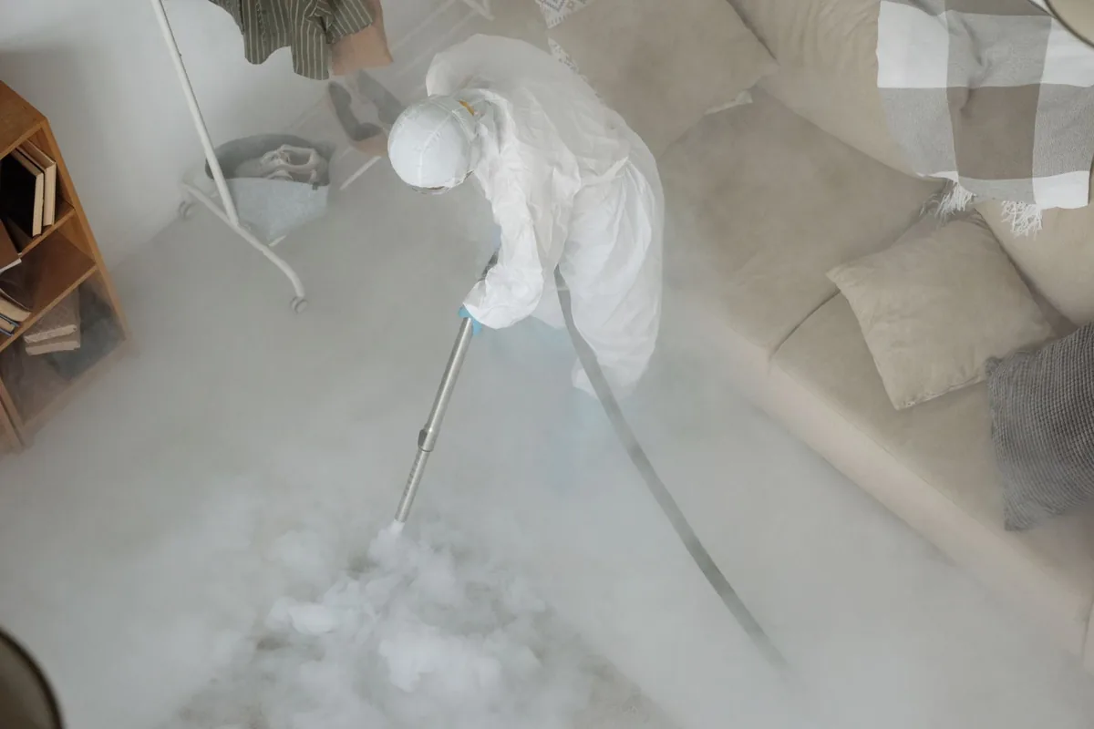 Biohazard cleanup technician in protective equipment, Monticello, MN